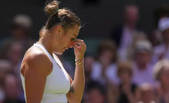 Aryana Sabalenka of Belarus reacts after losing a point against Laura Siegemund of Germany during a quarterfinal women's singles match at the Wimbledon Tennis Championships in London, Tuesday, July 8, 2025. (AP Photo/Kirsty Wigglesworth)