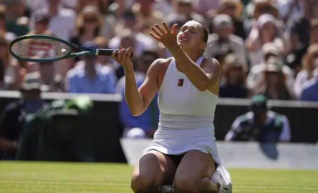Aryana Sabalenka of Belarus reacts after losing a point against Laura Siegemund of Germany during a quarterfinal women's singles match at the Wimbledon Tennis Championships in London, Tuesday, July 8, 2025. (AP Photo/Kirsty Wigglesworth)
