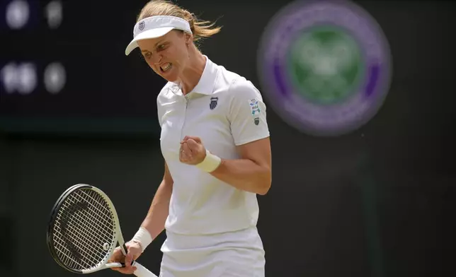 Liudmilla Samsonova of Russia reacts during the women's singles quarter final match against Iga Swiatek of Poland at the Wimbledon Tennis Championships in London, Wednesday, July 9, 2025.(AP Photo/Kirsty Wigglesworth)