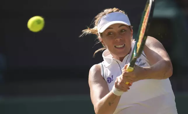 Anastasia Pavlyuchenkova of Russia returns the ball to Amanda Anisimova of the U.S. during the women's singles quarter finals match at the Wimbledon Tennis Championships in London, Tuesday, July 8, 2025.(AP Photo/Kin Cheung)