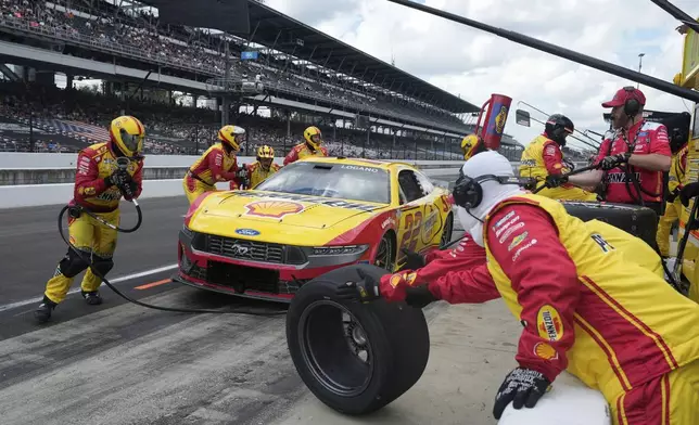 Joey Logano makes a pit stop during a NASCAR Cup Series auto race at Indianapolis Motor Speedway, Sunday, July 27, 2025, in Indianapolis. (AP Photo/Darron Cummings)