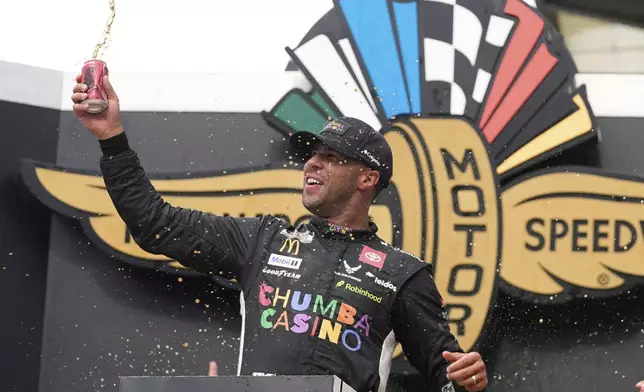 Bubba Wallace celebrates after winning a NASCAR Cup Series auto race at Indianapolis Motor Speedway, Sunday, July 27, 2025, in Indianapolis. (AP Photo/Darron Cummings)