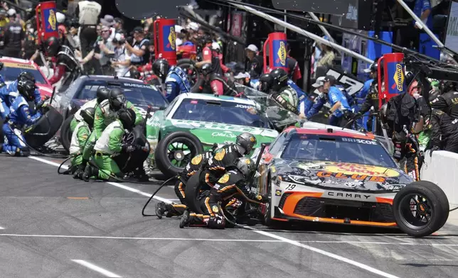 Chase Briscoe makes a pit stop during the NASCAR Cup Series auto race at Indianapolis Motor Speedway, Sunday, July 27, 2025, in Indianapolis. (AP Photo/Darron Cummings)