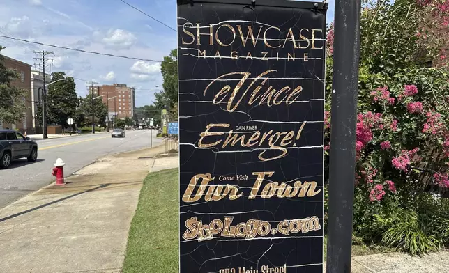 A sign outside the offices of Showcase Magazine, a monthly publication based in Danville, Va., where city Councilmember Lee Vogler was attacked and set on fire, is seen on Wednesday, July 30, 2025. (AP Photo/Allen G. Breed)