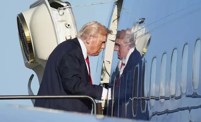 President Donald Trump boards Air Force One, Sunday, July 13, 2025, in Newark, N.J., en route to Washington. (AP Photo/Jacquelyn Martin)