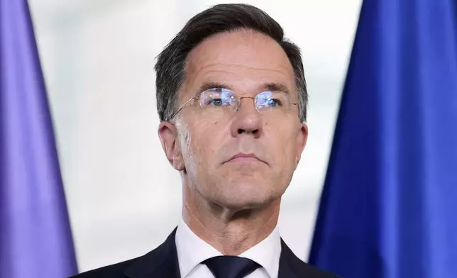 NATO Secretary General Mark Rutte attends a news conference with German Chancellor Friedrich Merz during a meeting at the chancellery in Berlin, Germany, Wednesday, July 9, 2025. (AP Photo/Markus Schreiber)