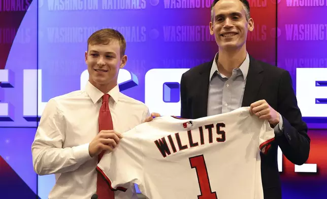 Washington Nationals first overall draft pick, shortstop Eli Willits, left, and Washington Nationals general manager Mike DeBartolo are introduced during a news conference, Saturday, July 19, 2025 in Washington. (AP Photo/Daniel Kucin Jr.)