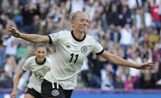 Germany's Lea Schueller celebrates after scoring her side's second goal during the Euro 2025, group C, soccer match between Germany and Denmark at St. Jakob-Park in Basel, Switzerland, Tuesday, July 8, 2025. (AP Photo/Martin Meissner)