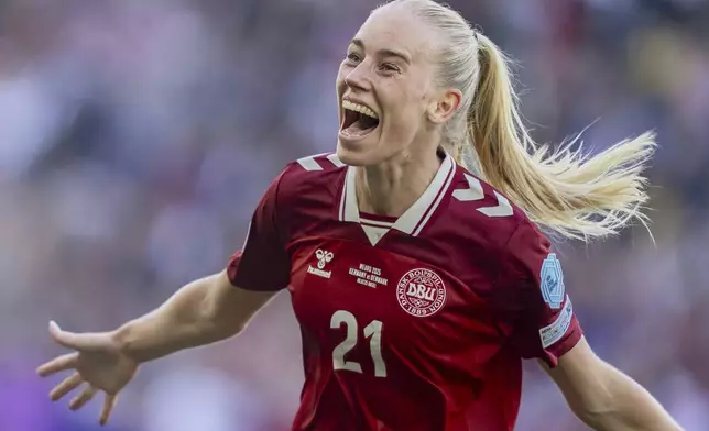 Denmark's Amalie Vangsgaard celebrates after scoring the opening goal during the Euro 2025, group C, soccer match between Germany and Denmark in Basel, Switzerland, Tuesday, July 8, 2025. (Til Buergy/Keystone via AP)