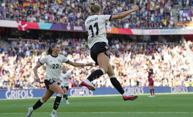 Germany's Lea Schueller celebrates after scoring her side's second goal during the Euro 2025, group C, soccer match between Germany and Denmark at St. Jakob-Park in Basel, Switzerland, Tuesday, July 8, 2025. (AP Photo/Martin Meissner)