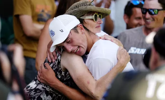 Britain's Oliver Tarvet celebrates winning his match against Switzerland's Leandro Riedi in the first round of the men’s singles at the Wimbledon Tennis Championships in London, Monday, June 30, 2025. ( Jordan Pettitt/PA via AP)