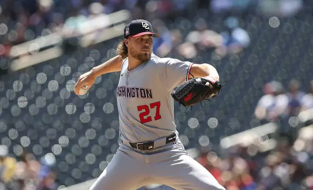 Washington Nationals pitcher Jake Irvin throws during the first inning of a baseball game against the Minnesota Twins, Sunday, July 27, 2025, in Minneapolis. (AP Photo/Stacy Bengs)