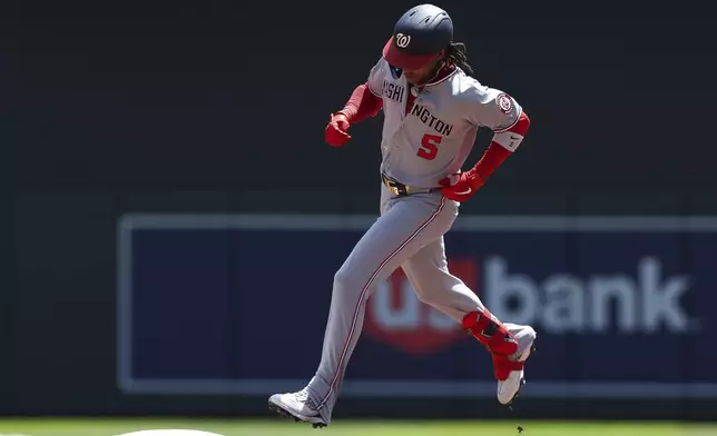 Washington Nationals' CJ Abrams runs through second base after hitting a home run during the first inning of a baseball game against the Minnesota Twins, Sunday, July 27, 2025, in Minneapolis. (AP Photo/Stacy Bengs)