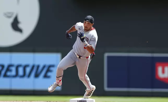 Washington Nationals' Daylen Lile runs through second base after hitting a triple against the Minnesota Twins during the fourth inning of a baseball game Sunday, July 27, 2025, in Minneapolis. (AP Photo/Stacy Bengs)