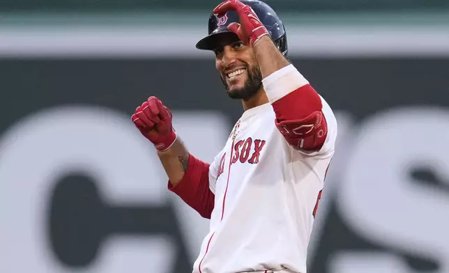Boston Red Sox's Abraham Toro celebrates after his two-RBI double during the second inning of a baseball game against the Colorado Rockies at Fenway Park, Monday, July 7, 2025, in Boston. (AP Photo/Charles Krupa)