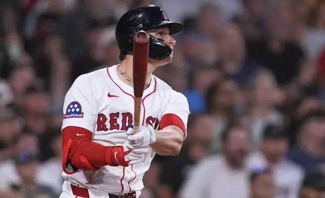 Boston Red Sox's Roman Anthony watches the flight of his two-run home run against the Colorado Rockies during the fifth inning of a baseball game at Fenway Park, Monday, July 7, 2025, in Boston. (AP Photo/Charles Krupa)