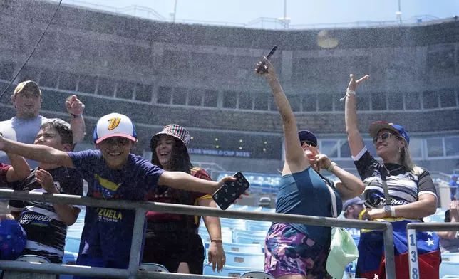 Fans await the Club World Cup round of 16 soccer match between Inter Milan and Fluminense in Charlotte, N.C., Monday, June 30, 2025. (AP Photo/Chris Carlson)