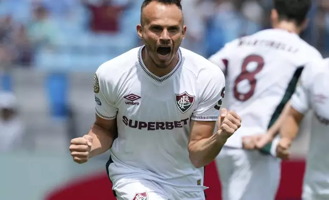 Fluminense's Rene celebrates after team mate Fluminense's German Cano scored his side's opening goal during the Club World Cup round of 16 soccer match between Inter Milan and Fluminense in Charlotte, N.C., Monday, June 30, 2025. (AP Photo/Chris Carlson)