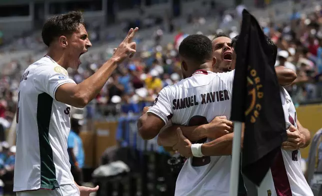 Fluminense's German Cano, right, celebrates with team mates after scoring his side's opening goal during the Club World Cup round of 16 soccer match between Inter Milan and Fluminense in Charlotte, N.C., Monday, June 30, 2025. (AP Photo/Chris Carlson)