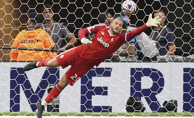 Juventus' Michele Di Gregorio saves during the Club World Cup round of 16 soccer match between Real Madrid and Juventus in Miami Gardens, Fla., Tuesday, July 1, 2025. (AP Photo/Rebecca Blackwell)