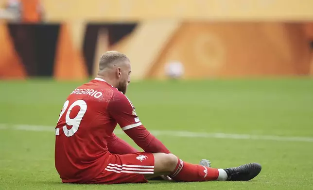 Juventus' Michele Di Gregorio sits dejected after the Club World Cup round of 16 soccer match between Real Madrid and Juventus in Miami Gardens, Fla., Tuesday, July 1, 2025. (AP Photo/Rebecca Blackwell)