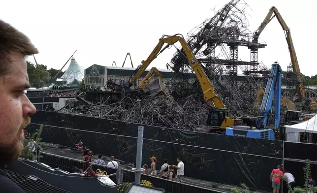 The burned main stage is seen at the Tomorrowland music festival in Boom, Belgium, Friday, July 18, 2025, two days after a huge fire destroyed the stage on Wednesday. (AP Photo/Omar Havana)