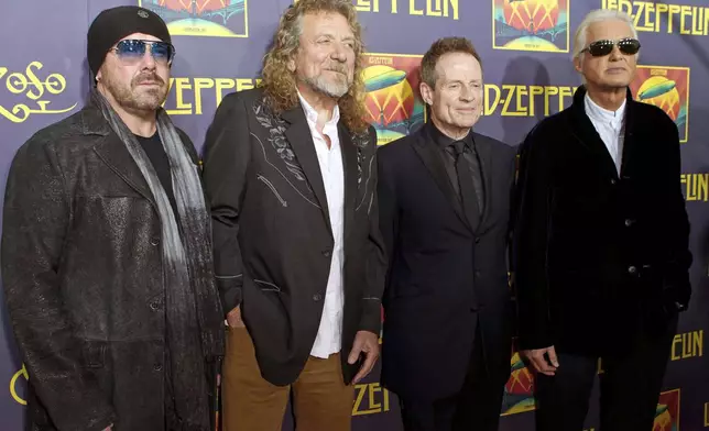 FILE - Jason Bonham, son of late Led Zeppelin drummer John Bonham;, from left, singer Robert Plant; bassist John Paul Jones; and guitarist Jimmy Page at the "Led Zeppelin: Celebration Day" premiere in New York on Oct. 9, 2012. (Photo by Dario Cantatore/Invision/AP, File)