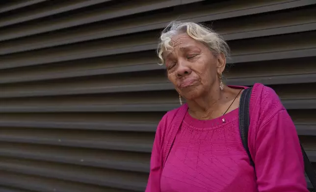 Yadira Almaraz, originally from Managua, Nicaragua, cries outside the ICE Los Angeles Staging Facility after visiting a young family member detained by federal agents in Los Angeles, on Wednesday, June 25, 2025. (AP Photo/Damian Dovarganes)