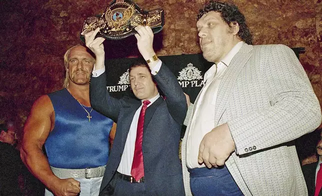 FILE - Real estate developer Donald Trump holds up the World Wrestling Federation Championship belt as he flanked by wrestlers Hulk Hogan, left and Andre the Giant durinig a news conference, Tuesday, March 15, 1988, in New York, announcing "WrestleMania IV" at Trump Plaza in Atlantic City. (AP Photo/Susan Ragan, File)