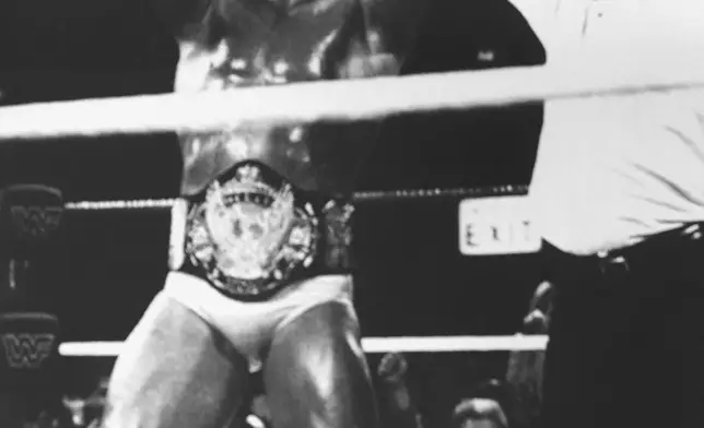 FILE - Hulk Hogan, left, wins back the World Wrestling Federation Title as he his declared the winner after defeating Randy "Macho Man" Savage during WrestleMania V, sponsored by Trump Plaza Hotel Casino, Sunday, April 4, 1989, in Atlantic City, N.J. (AP Photo/B. Vartan Boyajian, File)