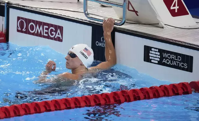 Katie Ledecky of the United States reacts after competing in the women's 1500-meter freestyle heats at the World Aquatics Championships in Singapore, Monday, July 28, 2025. (AP Photo/Lee Jin-man)
