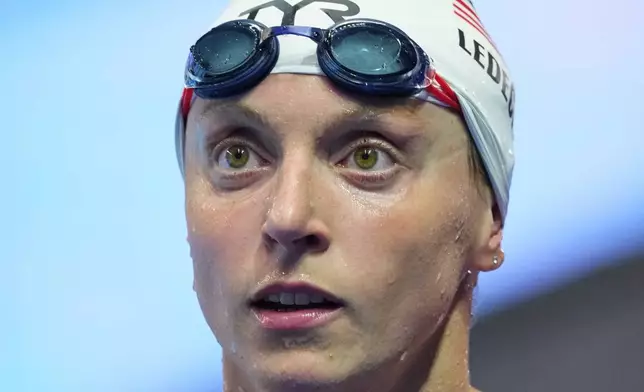Katie Ledecky of the United States reacts as she leaves after competing in the women's 1500-meter freestyle heats at the World Aquatics Championships in Singapore, Monday, July 28, 2025. (AP Photo/Vincent Thian)