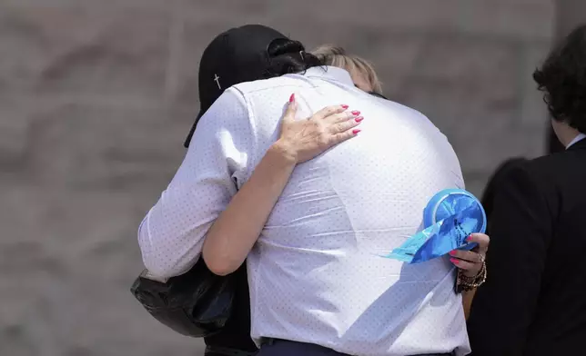 Father of Kaylee Goncalves, Steve Goncalves, hugs mother Kristi Goncalves after Bryan Kohberger's plea deal hearing on Wednesday, July 2, 2025, in Boise, Idaho. (AP Photo/Jenny Kane)