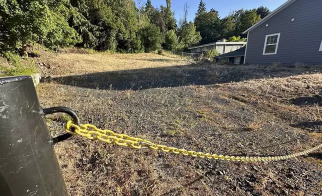 An empty lot stands on Monday, June 30, 2025, at the site where four University of Idaho students were killed in November 2022 inside a house in Moscow, Idaho. (AP Photo/Manuel Valdes)
