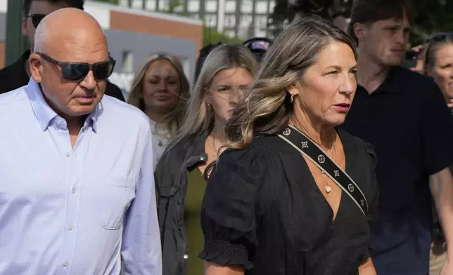 The family of Ethan Chapin including mother Stacy Chapin and father Jim Chapin walk to the Ada County Courthouse for Bryan Kohberger's plea deal hearing on Wednesday, July 2, 2025, in Boise, Idaho. (AP Photo/Jenny Kane)