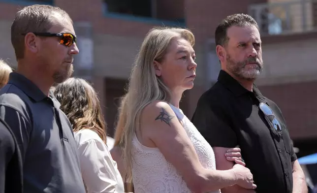 Karen and Scott Laramie, the mother and stepfather of Madison Mogen, listen as their attorney Leander James makes a statement to members of the media outside the Ada County Courthouse on Wednesday, July 2, 2025, in Boise, Idaho. (AP Photo/Jenny Kane)