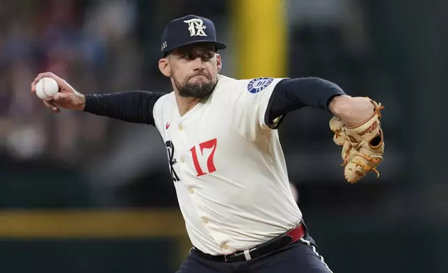 Texas Rangers starting pitcher Nathan Eovaldi throws to the Atlanta Braves in the second inning of a baseball game Friday, July 25, 2025, in Arlington, Texas. (AP Photo/Tony Gutierrez)