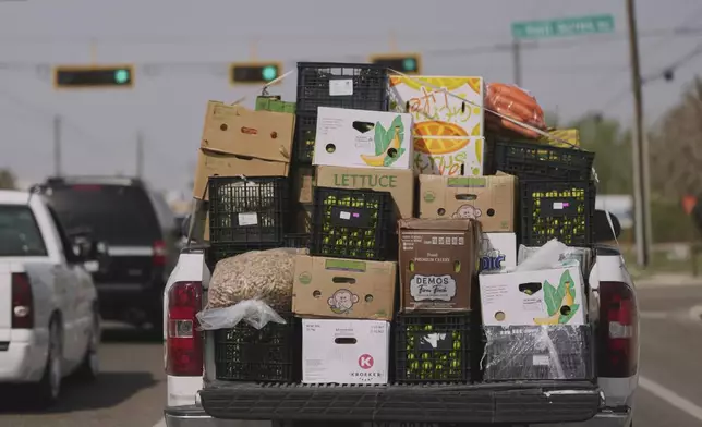 FILE - A truck loaded with produce from Mexico and Canada passes through Pharr, Texas, March 4, 2025. (AP Photo/Eric Gay, File)