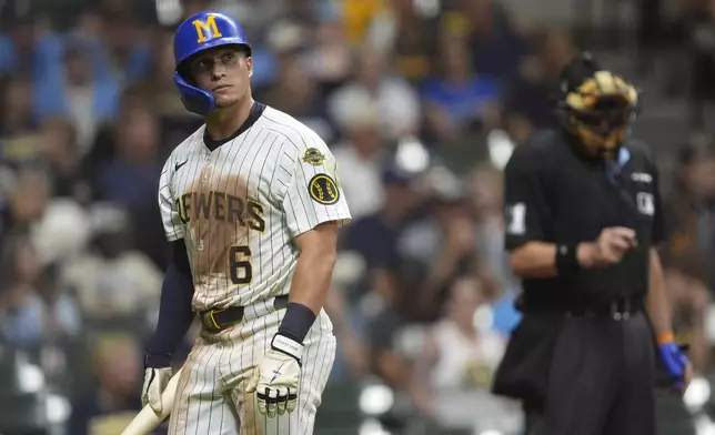 Milwaukee Brewers' Isaac Collins looks on after striking out during the ninth inning of a baseball game against the Miami Marlins, Saturday, July 26, 2025, in Milwaukee. (AP Photo/Aaron Gash)