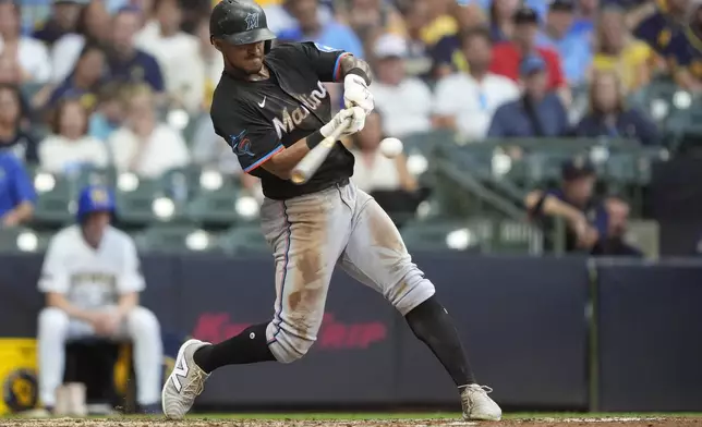 Miami Marlins' Dane Myers hits a two-run home run during the sixth inning of a baseball game against the Milwaukee Brewers, Saturday, July 26, 2025, in Milwaukee. (AP Photo/Aaron Gash)