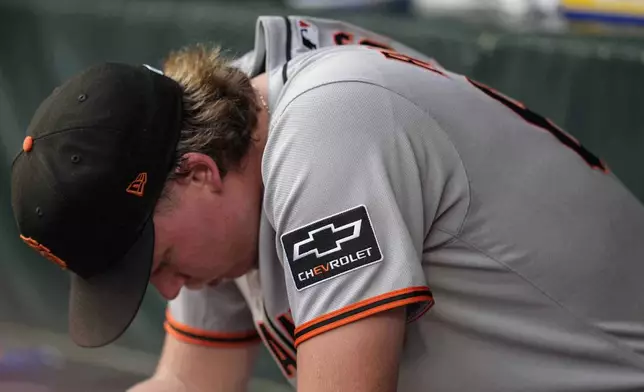 San Francisco Giants pitcher Hayden Birdsong (60) sits in the dugout after being relieved in the first inning of a baseball game against the Atlanta Braves, Monday, July 21, 2025, in Atlanta. (AP Photo/Mike Stewart)