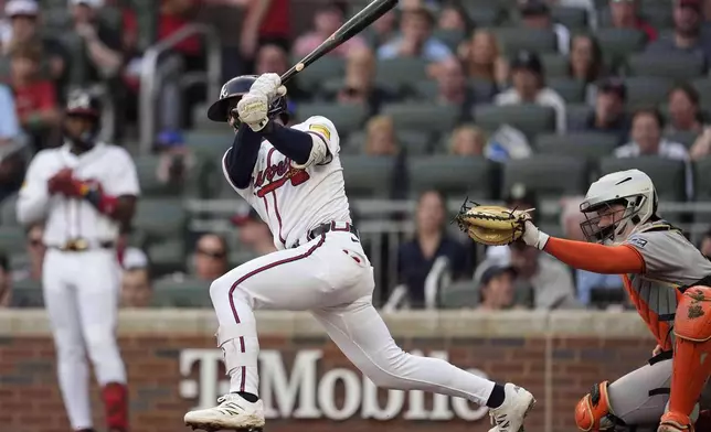 Atlanta Braves' Drake Baldwin (30) hits a two-RBI single against the San Francisco Giants in the first inning of a baseball game, Monday, July 21, 2025, in Atlanta. (AP Photo/Mike Stewart)