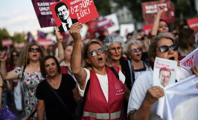 Women shout slogans during a protest called by the main opposition Republican People's Party or (CHP), outside the City Hall in Istanbul, Turkey, Tuesday, July 1, 2025. (AP Photo/Francisco Seco)