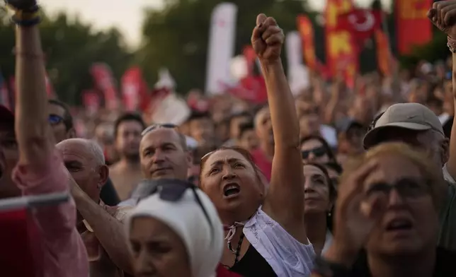 People chant slogans during a protest called by main opposition Republican People's Party or (CHP), outside the City Hall in Istanbul, Turkey, Tuesday, July 1, 2025. (AP Photo/Khalil Hamra)