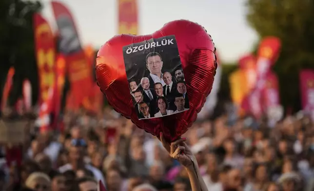 People attend a protest called by main opposition Republican People's Party or (CHP), outside the City Hall in Istanbul, Turkey, Tuesday, July 1, 2025. (AP Photo/Khalil Hamra)
