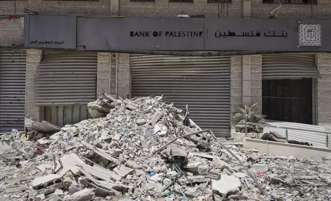 A destroyed branch of the Bank of Palestine in the Tal al-Hawa neighborhood of Gaza City is seen Wednesday, July 9, 2025. (AP Photo/Jehad Alshrafi)