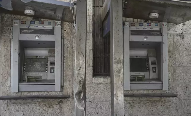 Broken Arab Bank ATMs are seen in Gaza City on Wednesday, July 9, 2025. (AP Photo/Jehad Alshrafi)