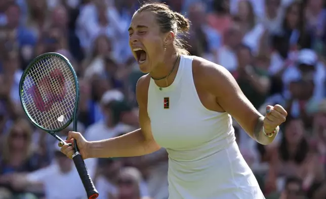 Aryana Sabalenka of Belarus celebrates after beating Laura Siegemund of Germany to win a quarterfinal women's singles match at the Wimbledon Tennis Championships in London, Tuesday, July 8, 2025. (AP Photo/Kirsty Wigglesworth)