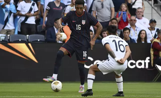 United States defender Alexander Freeman (16) controls the ball as Guatemala defender Jose Morales (16) defends during the first half of a CONCACAF Gold Cup semifinal soccer match, Wednesday, July 2, 2025, in St. Louis. (AP Photo/Connor Hamilton)