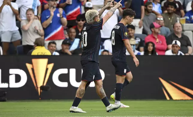 United States midfielder Diego Luna (10) reacts after scoring a goal against Guatemala during the first half of a CONCACAF Gold Cup semifinal soccer match, Wednesday, July 2, 2025, in St. Louis. (AP Photo/Connor Hamilton)